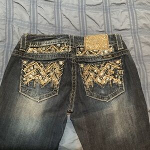 Miss Me Blue and Gold Boot Cut Jeans with Intricate Embroidery.